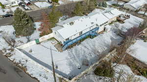 Snowy aerial view with a residential view