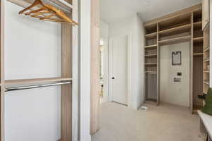 In closet washer and dryer area.