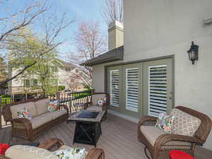 Deck featuring visible vents and an outdoor hangout area