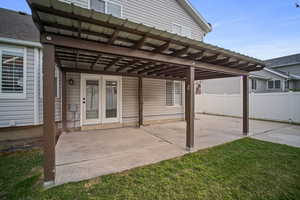 View of patio featuring fence