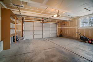 Garage featuring a garage door opener