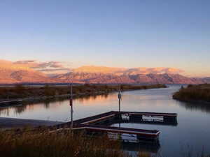 View of dock with a water and mountain view
