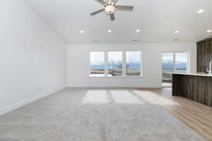 Unfurnished living room with baseboards, visible vents, recessed lighting, and a ceiling fan