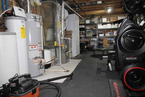 Basement with water heater, water softener, humidifier and large freezer