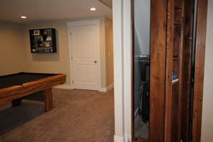 Playroom with carpet flooring, pool table, and recessed lighting and murphy door