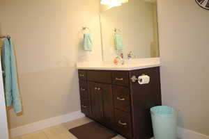 Another view of full basement bathroom with vanity and sink