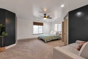 Bedroom with baseboards, recessed lighting, ceiling fan, and carpet flooring