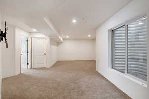 Empty room with carpet floors and recessed lighting