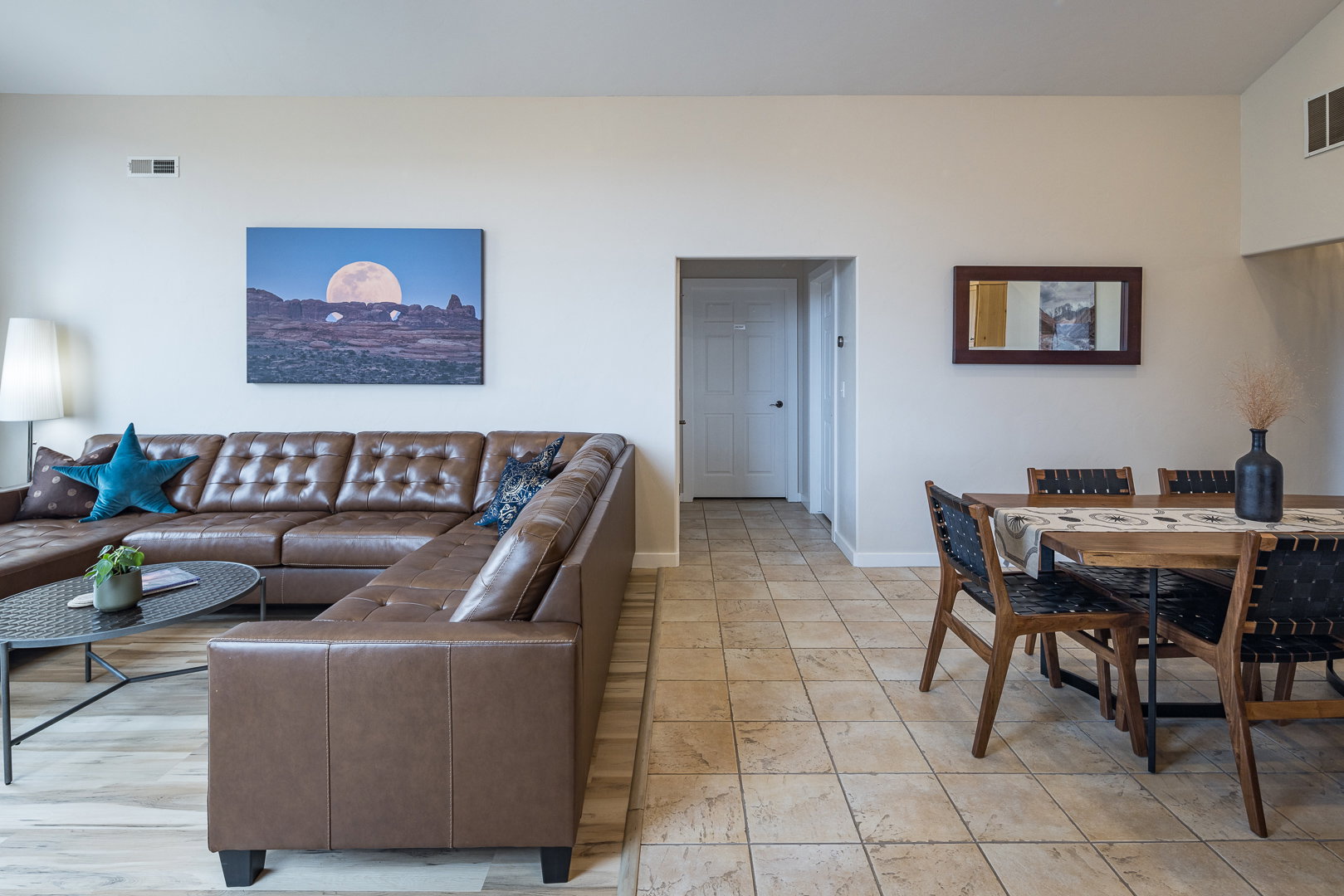 Living area with baseboards and visible vents