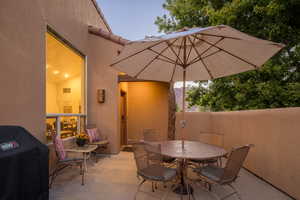 View of patio / terrace with outdoor dining area, visible vents, and grilling area