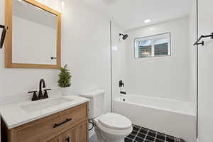 Full bathroom with bathing tub / shower combination, recessed lighting, toilet, and vanity