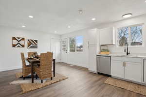 Dining area with recessed lighting, baseboards, and wood finished floors