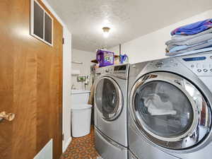 Washer and dryer are included in the sale .