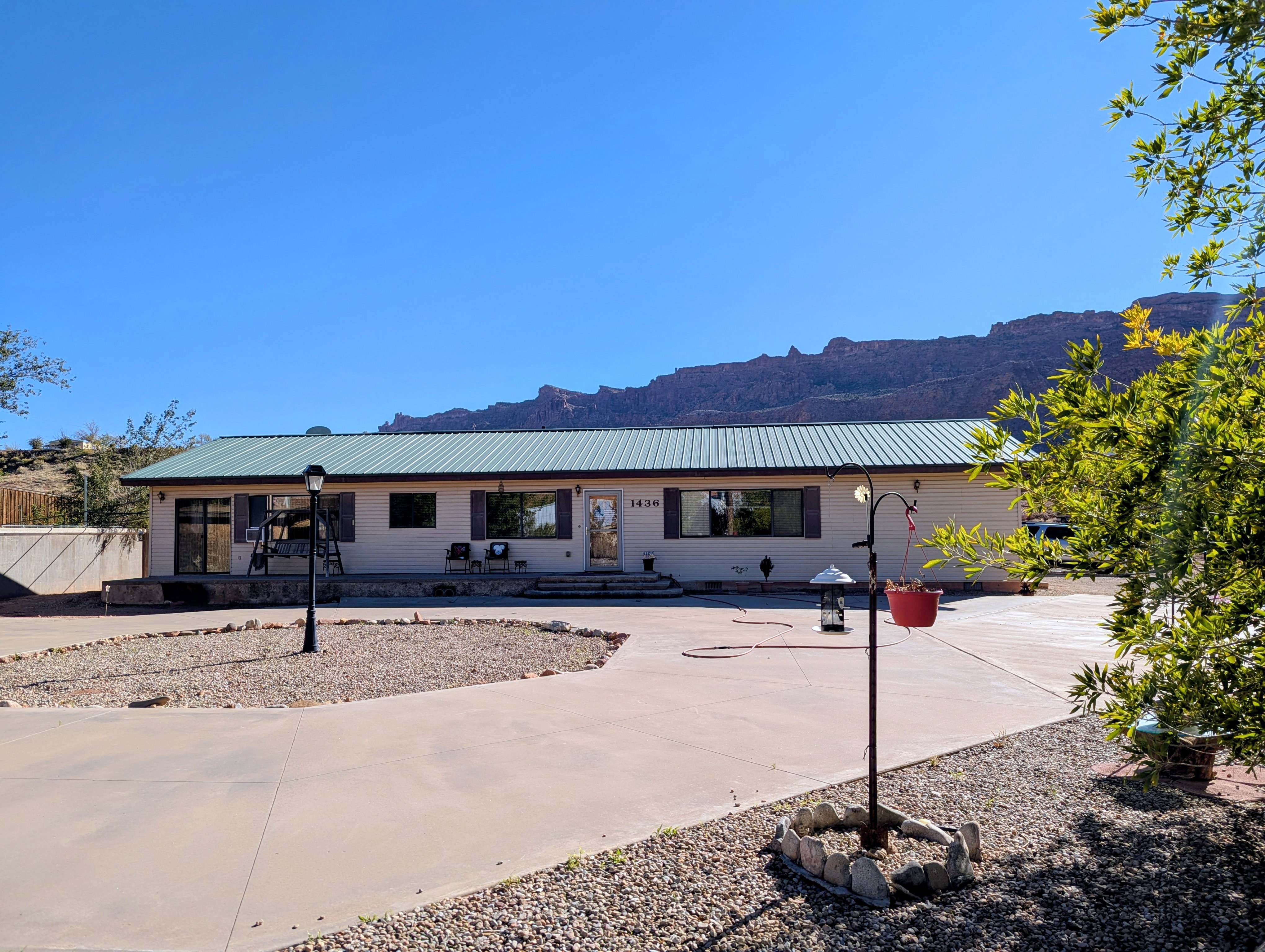 Ranch-style home featuring a metal roof and a mountain view
