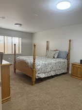 Bedroom featuring baseboards and carpet flooring