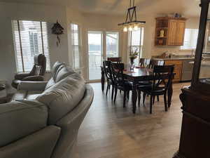 Dining room with plenty of natural light and light wood-style flooring