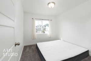 Bedroom featuring baseboards and carpet flooring
