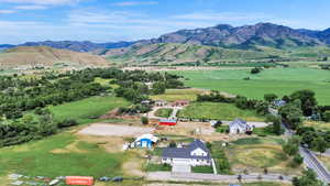 Aerial view of sparsely populated area with a mountainous background