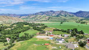 Aerial view of property's location with a mountainous background and rural landscape