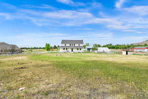 View of yard with a mountain view and a rural view