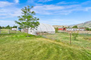 View of yard featuring an outbuilding and a mountain view