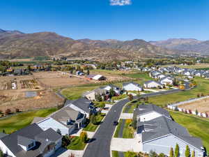 Drone / aerial view featuring a mountain view and a residential view