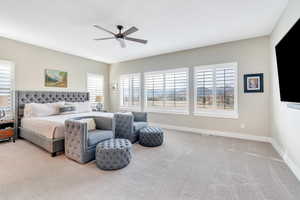 Bedroom featuring baseboards, visible vents, ceiling fan, and carpet