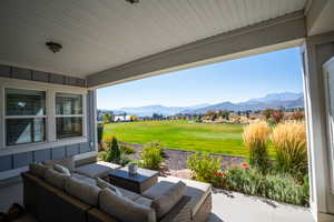 View of patio / terrace with a mountain view and an outdoor living space