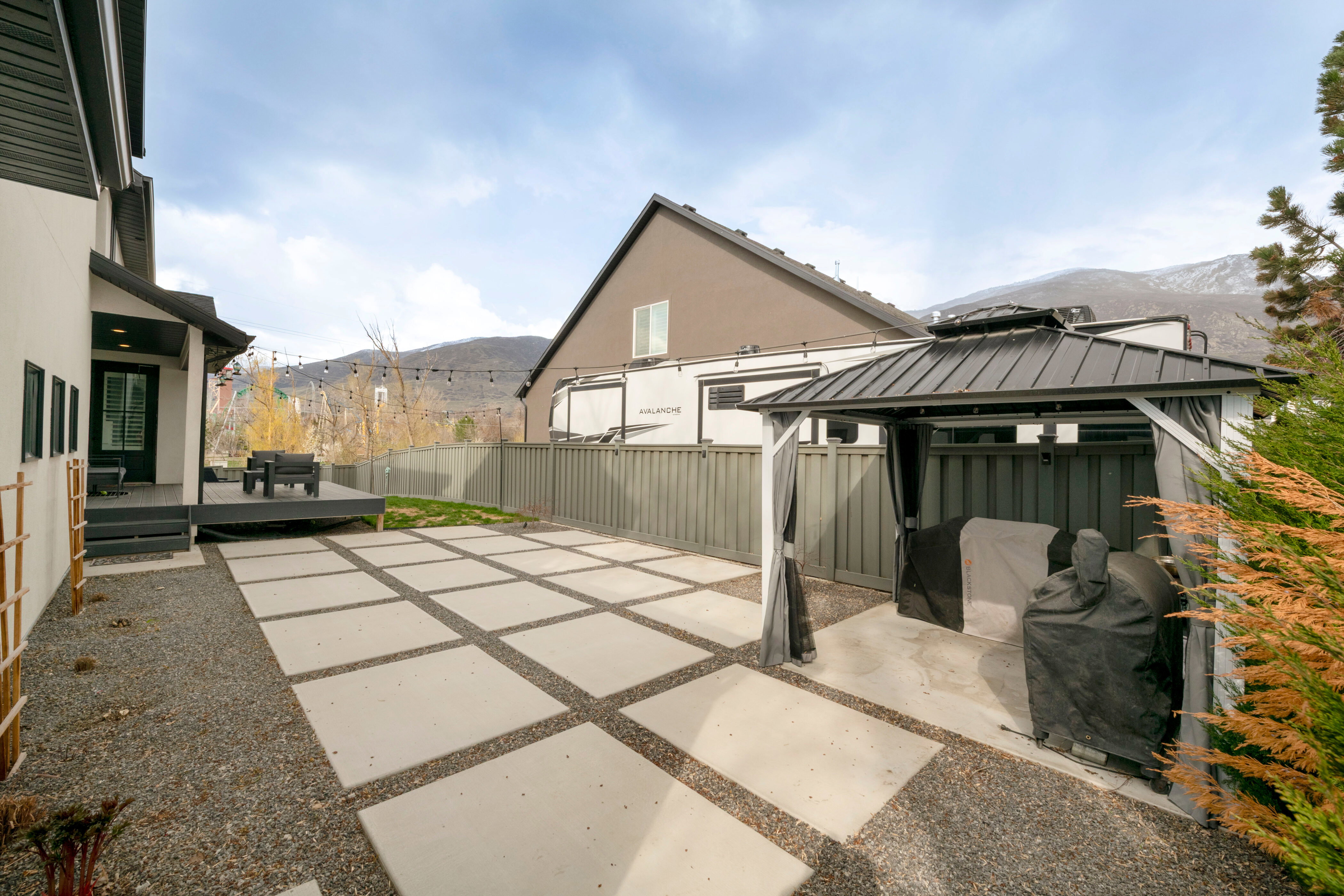 View of patio / terrace with a deck with mountain view, a gazebo, and fence
