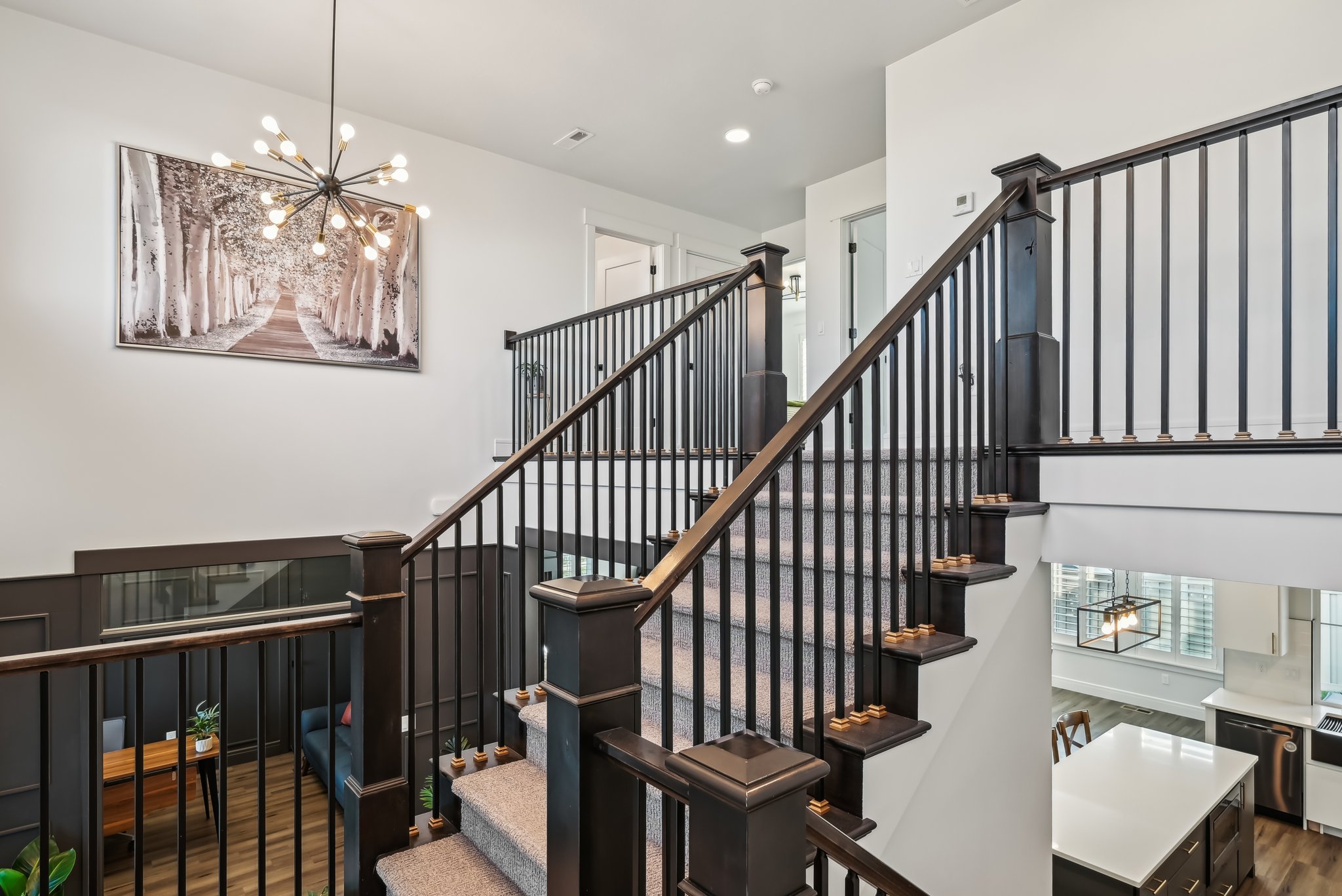 Stairs with wood finished floors, an inviting chandelier, visible vents, and recessed lighting