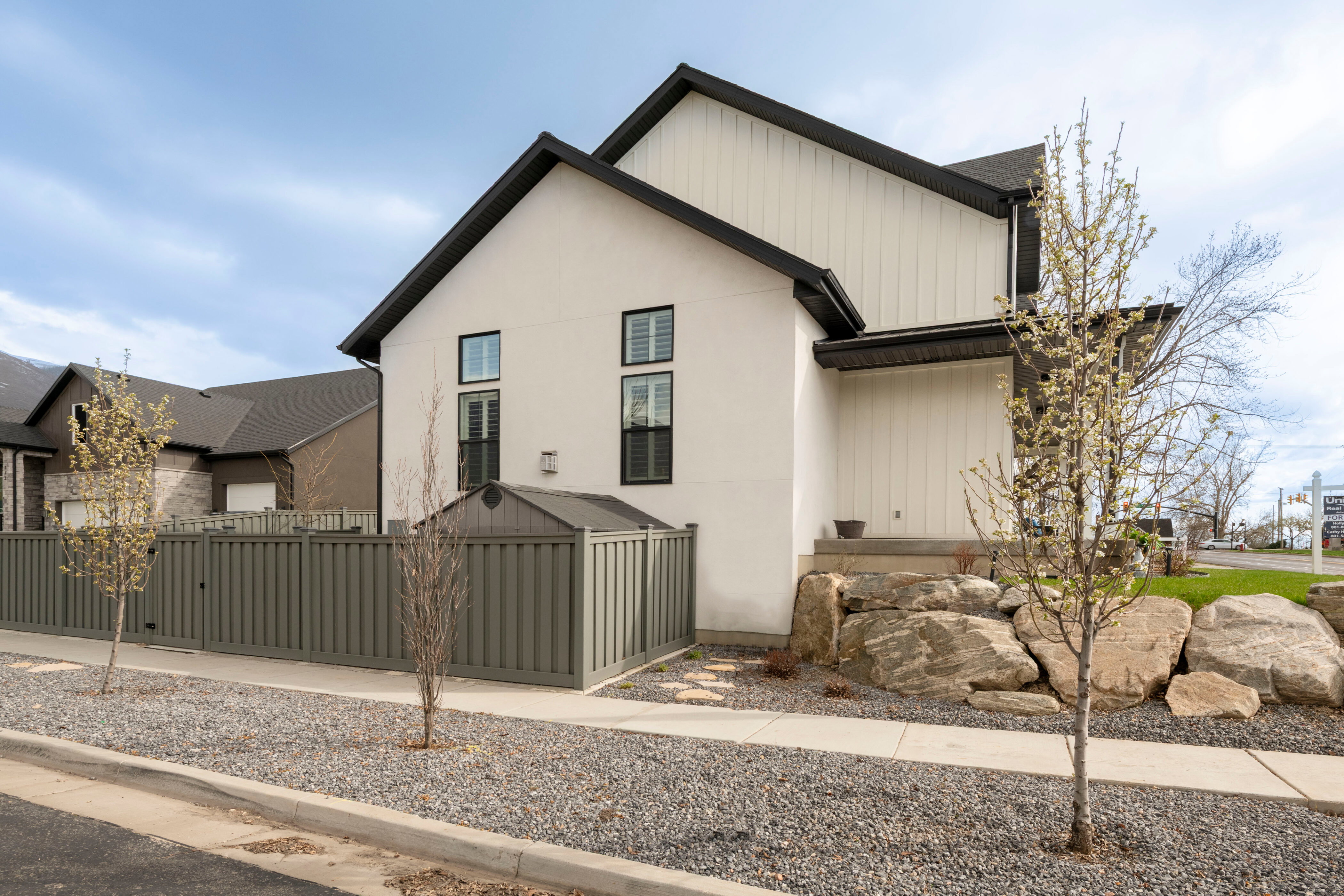 Modern farmhouse with a fenced front yard