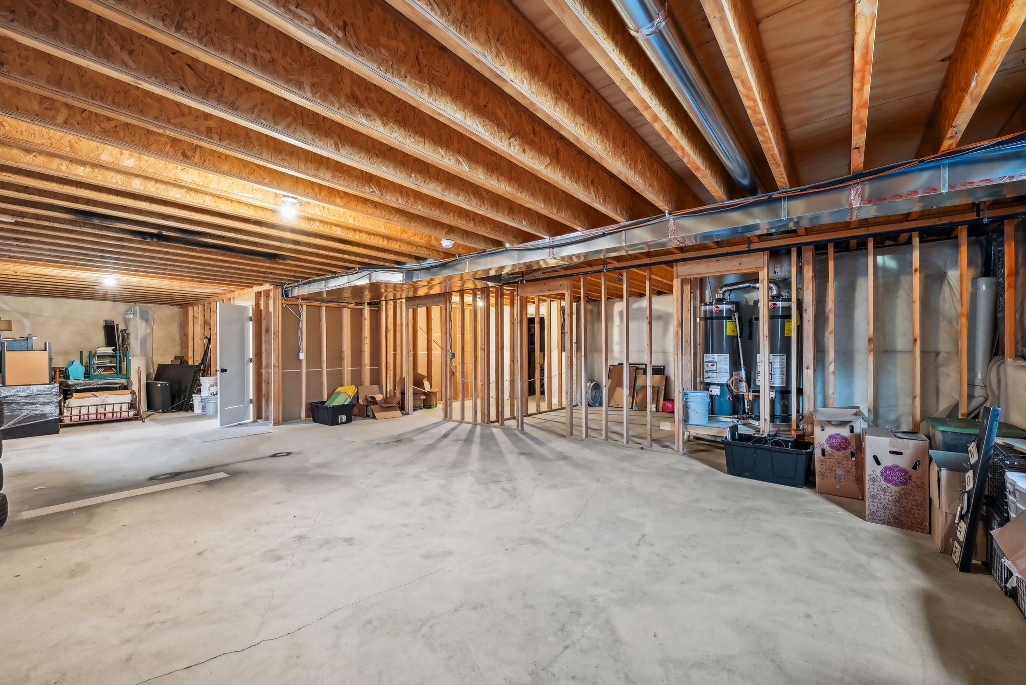 Unfinished below grade area with strapped water heater
