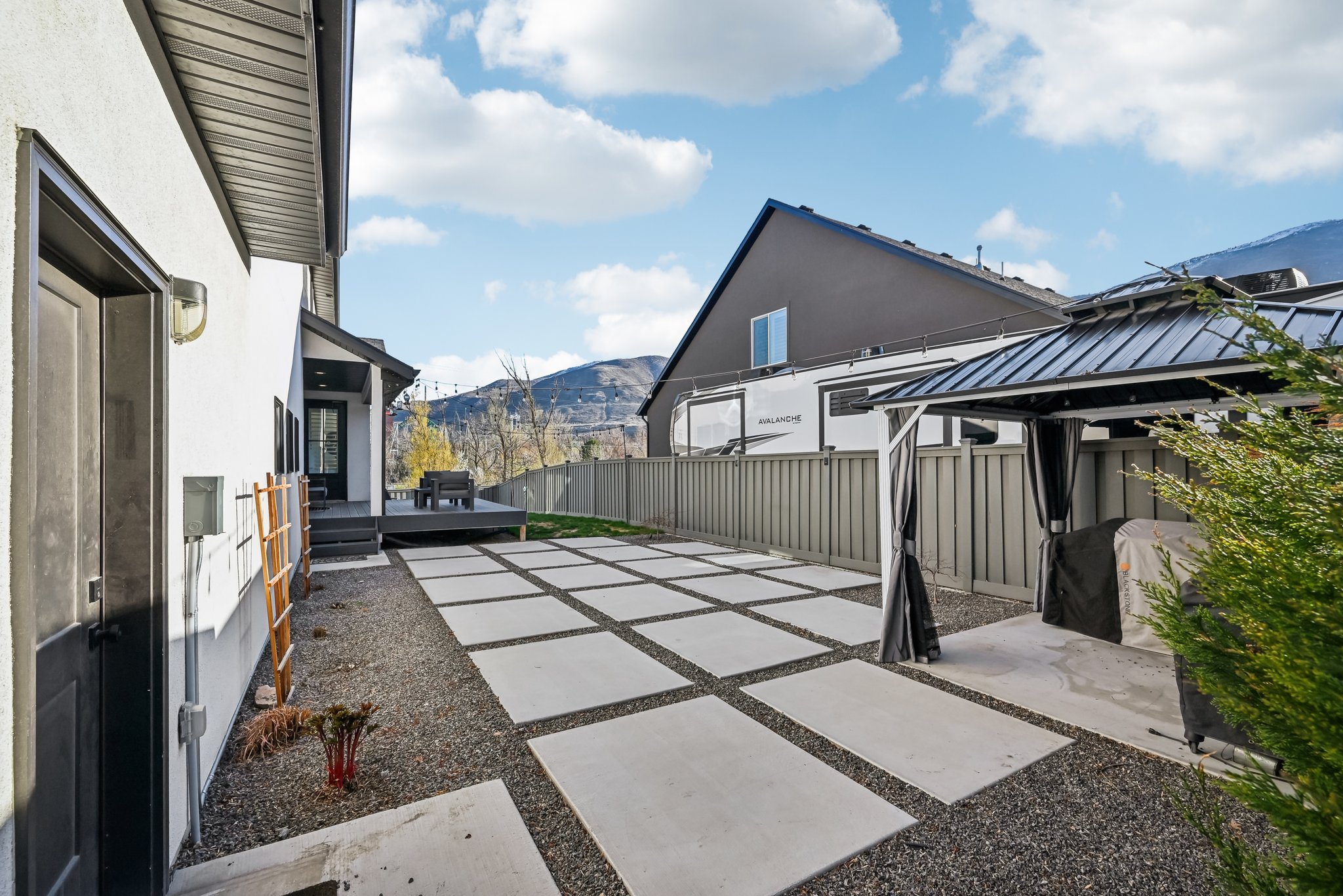 View of patio featuring fence, a gazebo, and a mountain view