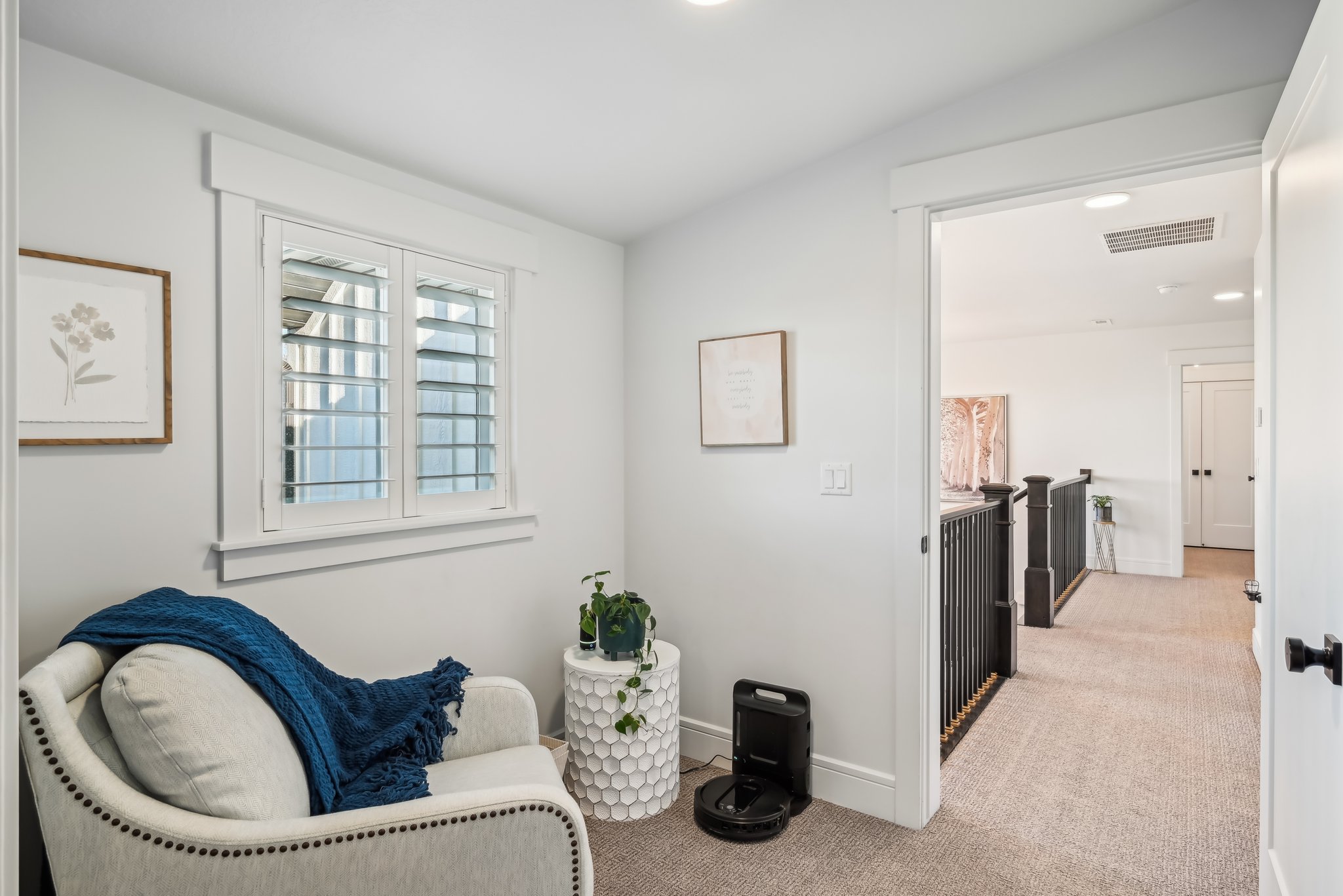 Living area featuring baseboards, vaulted ceiling, recessed lighting, visible vents, and light colored carpet
