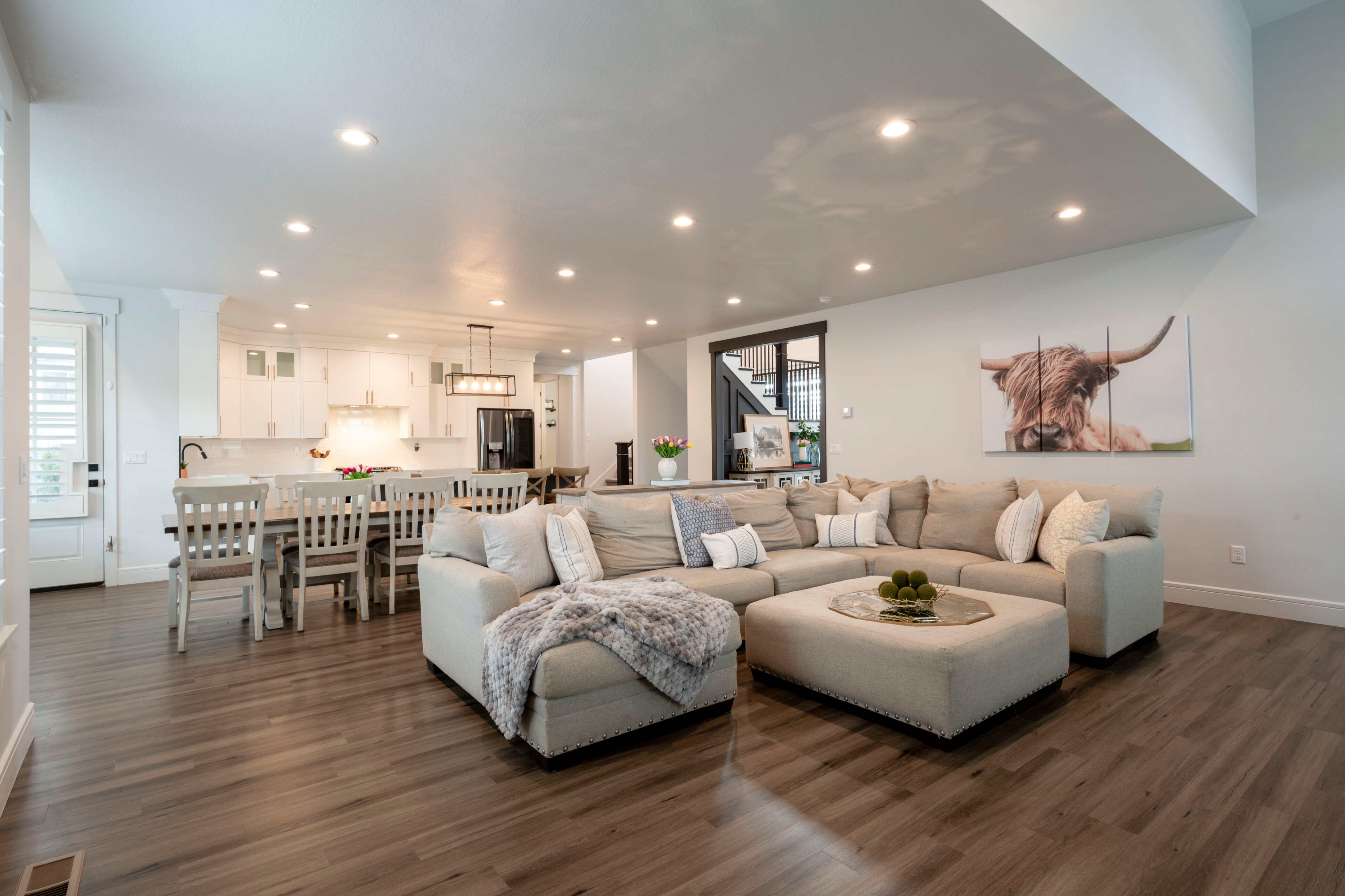 Living room featuring baseboards, visible vents, recessed lighting, and dark wood-style flooring