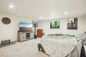 Bedroom featuring recessed lighting and carpet