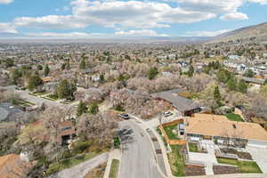 Birds eye view of property with a residential view and a mountain view