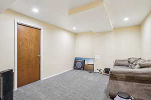 Sitting room with baseboards, carpet, and recessed lighting