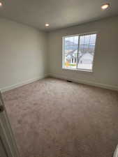 Bedroom with carpet flooring and recessed lighting