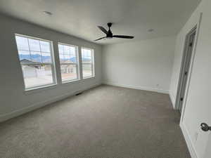 Primary Suite with 3 windows, Tall Baseboards and Ceiling Fan