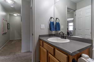 Bathroom with baseboards and vanity