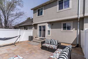 This glorious patio offers an adorable gathering or play space with no maintenance.