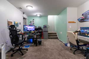 The finished area of the basement offers privacy with a door at the top of the stairs and a room large enough to flex to your needs.