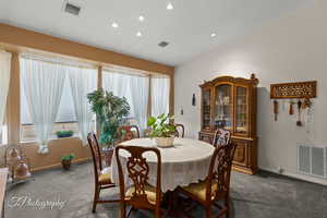 Dining area featuring baseboards, visible vents, recessed lighting, and carpet
