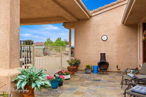 View of patio with fence