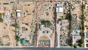 Birds eye view of property featuring a desert view