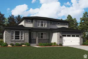 View of front of property with stone siding, an attached garage, a front lawn, and concrete driveway