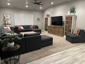 Living area featuring recessed lighting, light carpet, visible vents, and ceiling fan