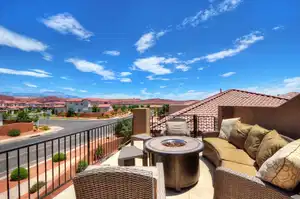 Balcony with outdoor lounge area, a residential view, and a mountain view