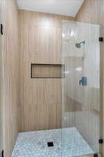 Full bath with a shower stall